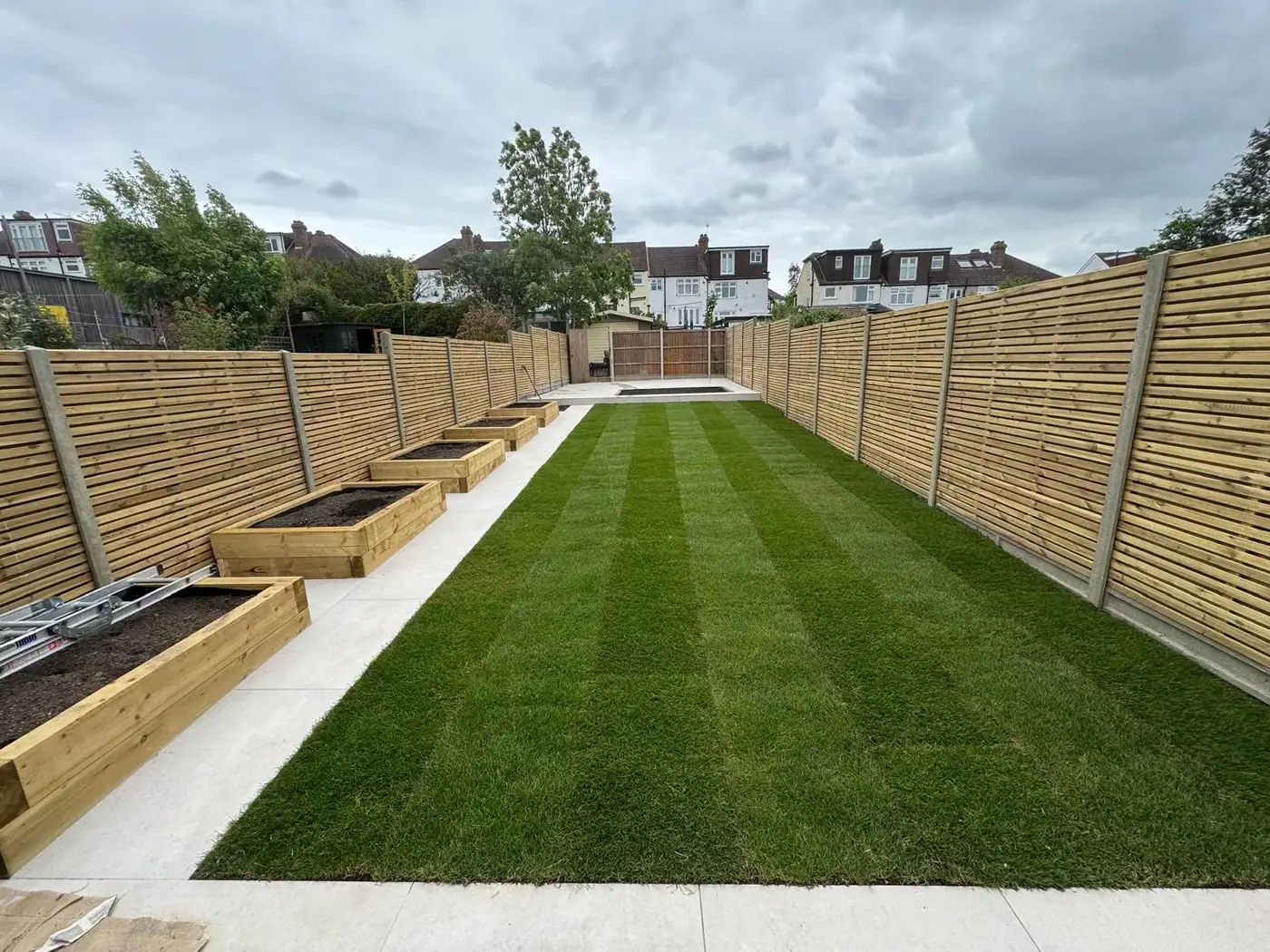 Porcelain garden terrace, lawn & pergola; photograph 2