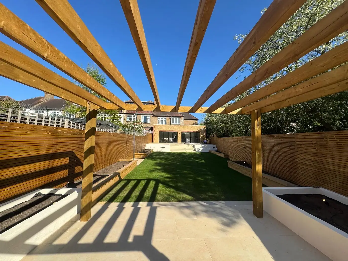 Porcelain garden terrace, lawn & pergola; photograph 6