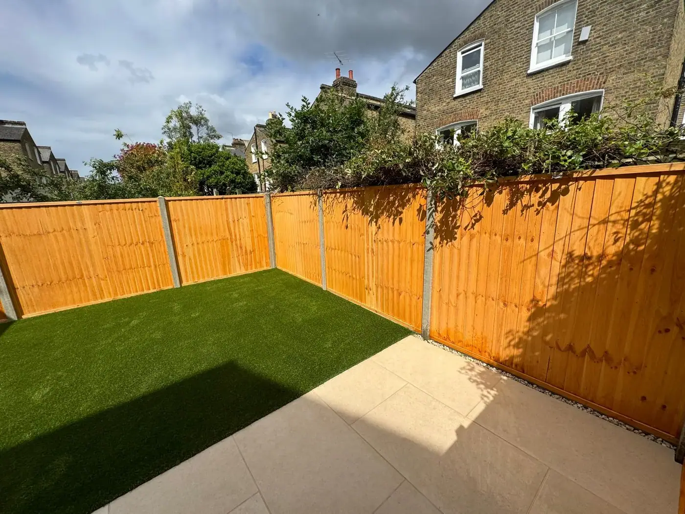 New lawn, paving & timber fencing; photograph 30