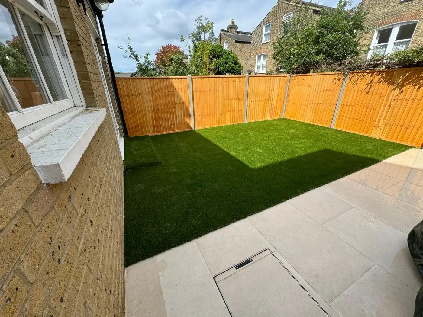 New lawn, paving & timber fencing; photograph 31
