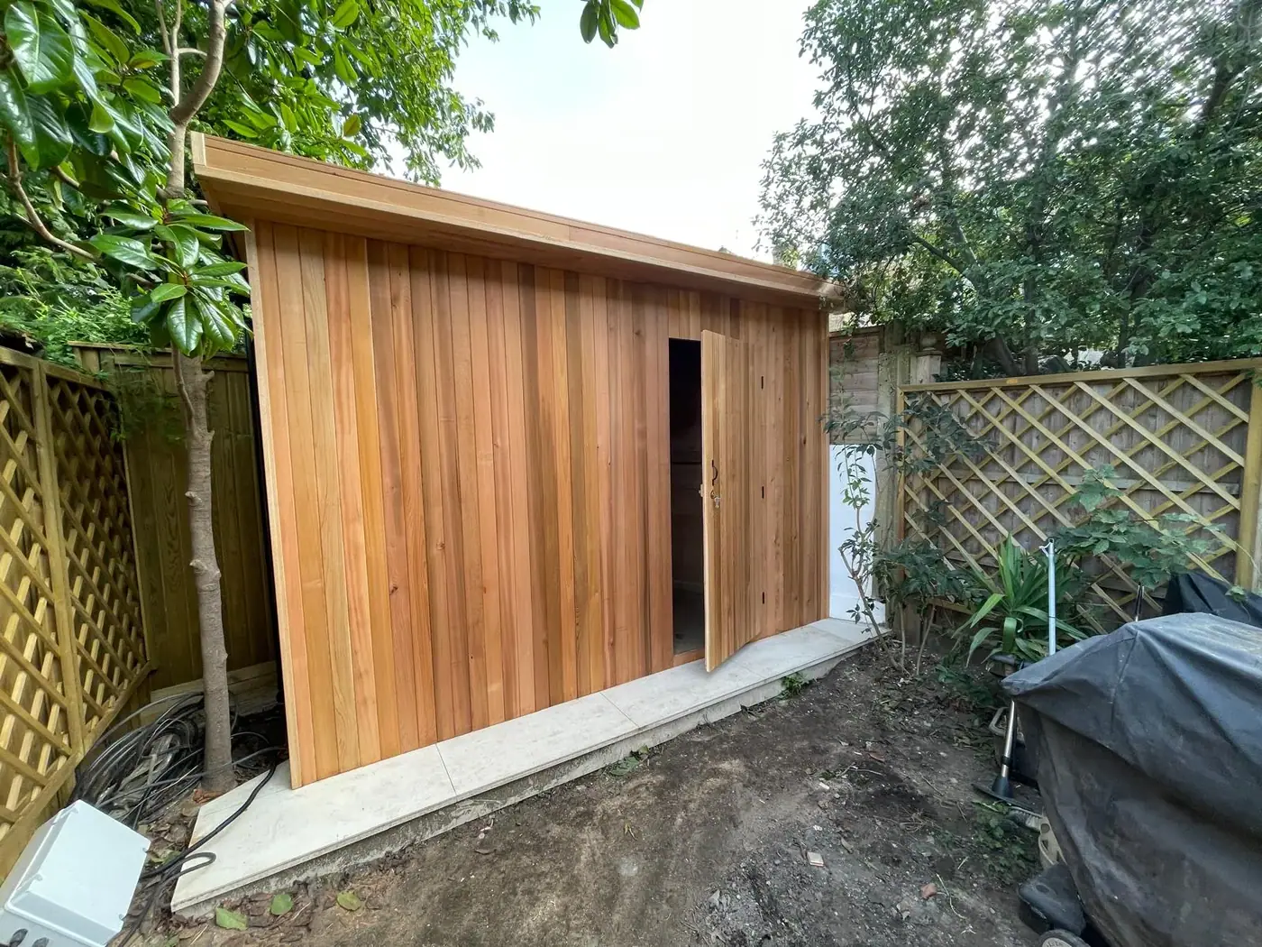 Timber-clad garden store; photograph 56
